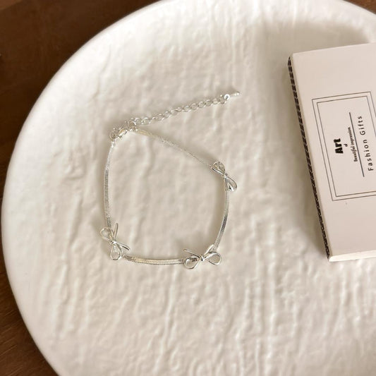 Bow Trio Bracelet In Silver